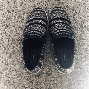 Gold and black slip on shoes